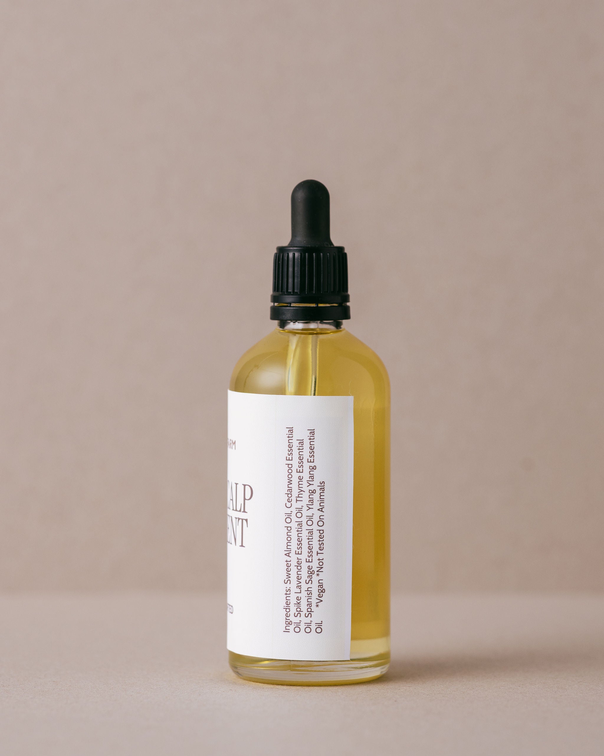 Nourishing hair and scalp treatment oil in a luxurious glass bottle with a glass dropper, handmade at Lavandula Farm