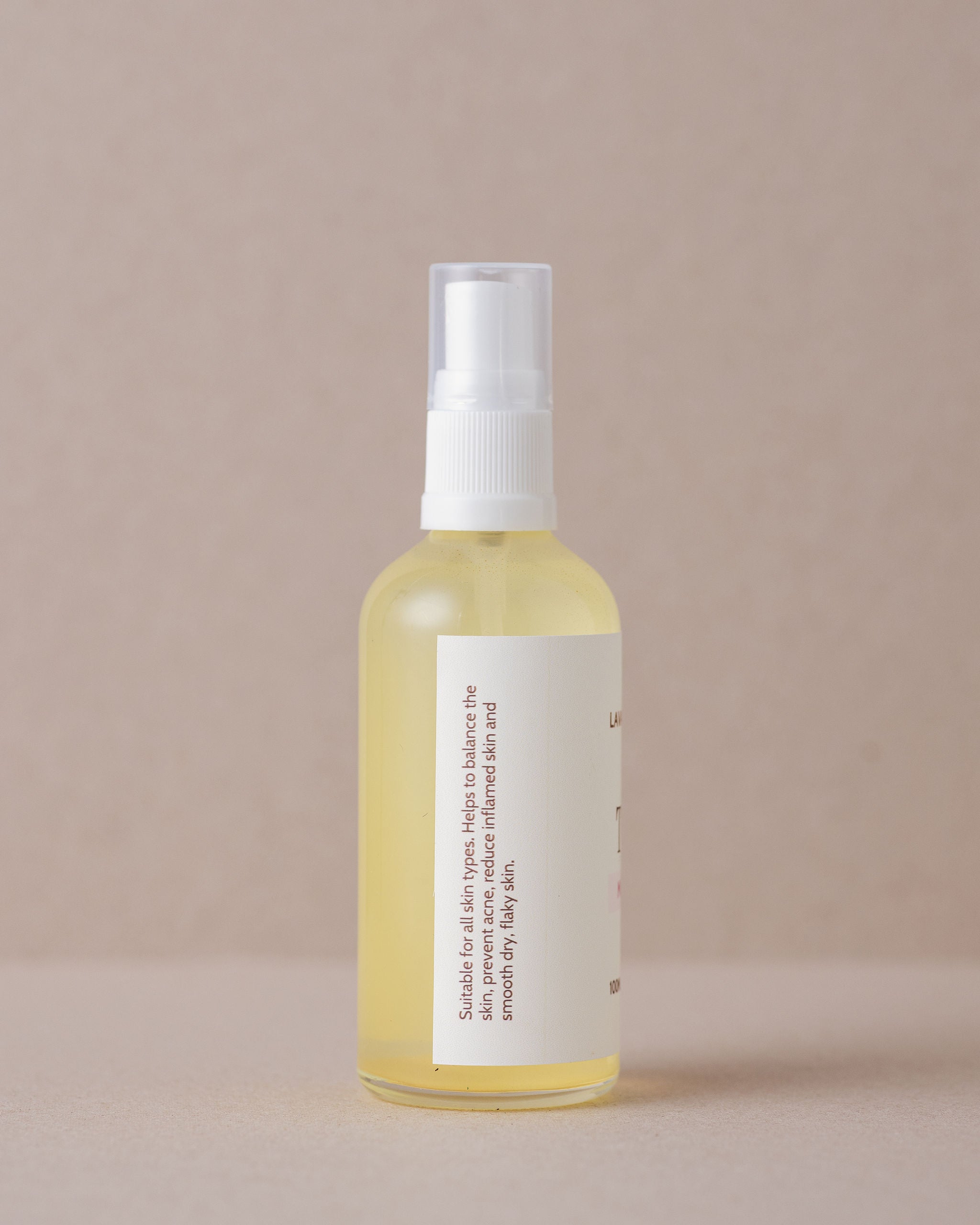 Rose water skin toner in a glass bottle made with natural ingredients at Lavandula Farm