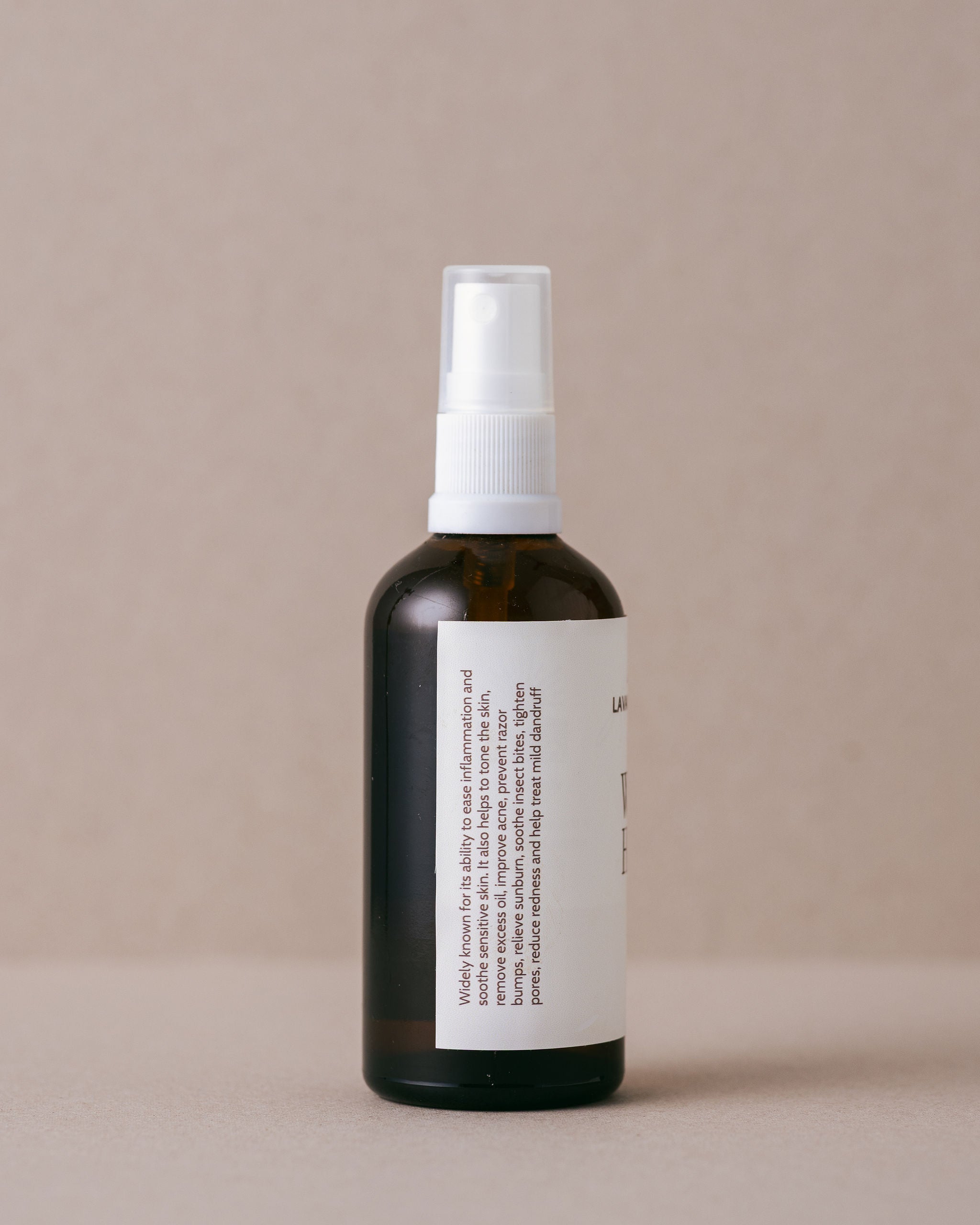 Natural pure witch hazel in a glass jar with a spray top