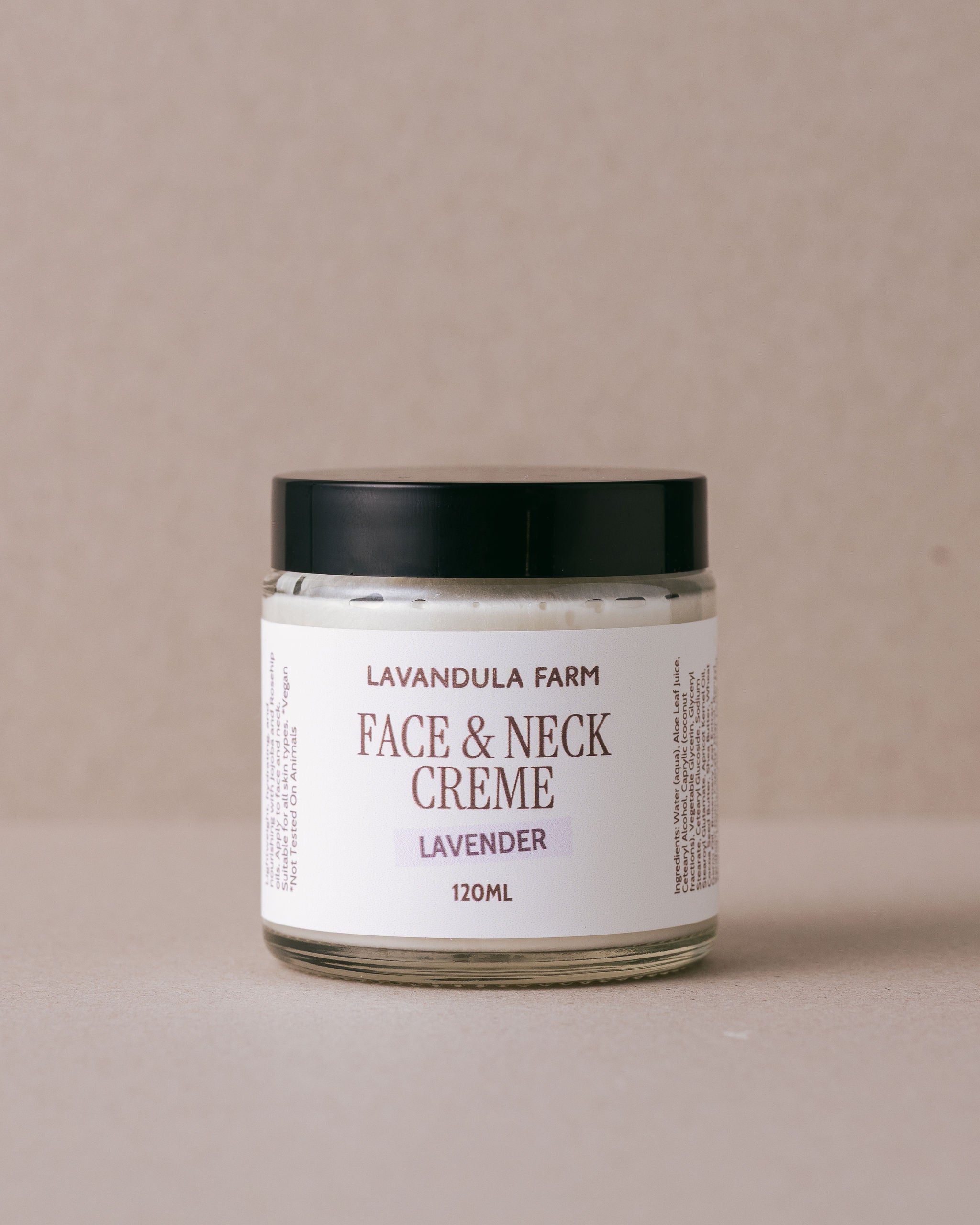 Face and neck creme in a glass jar with a white label handmade at Lavandula Farm