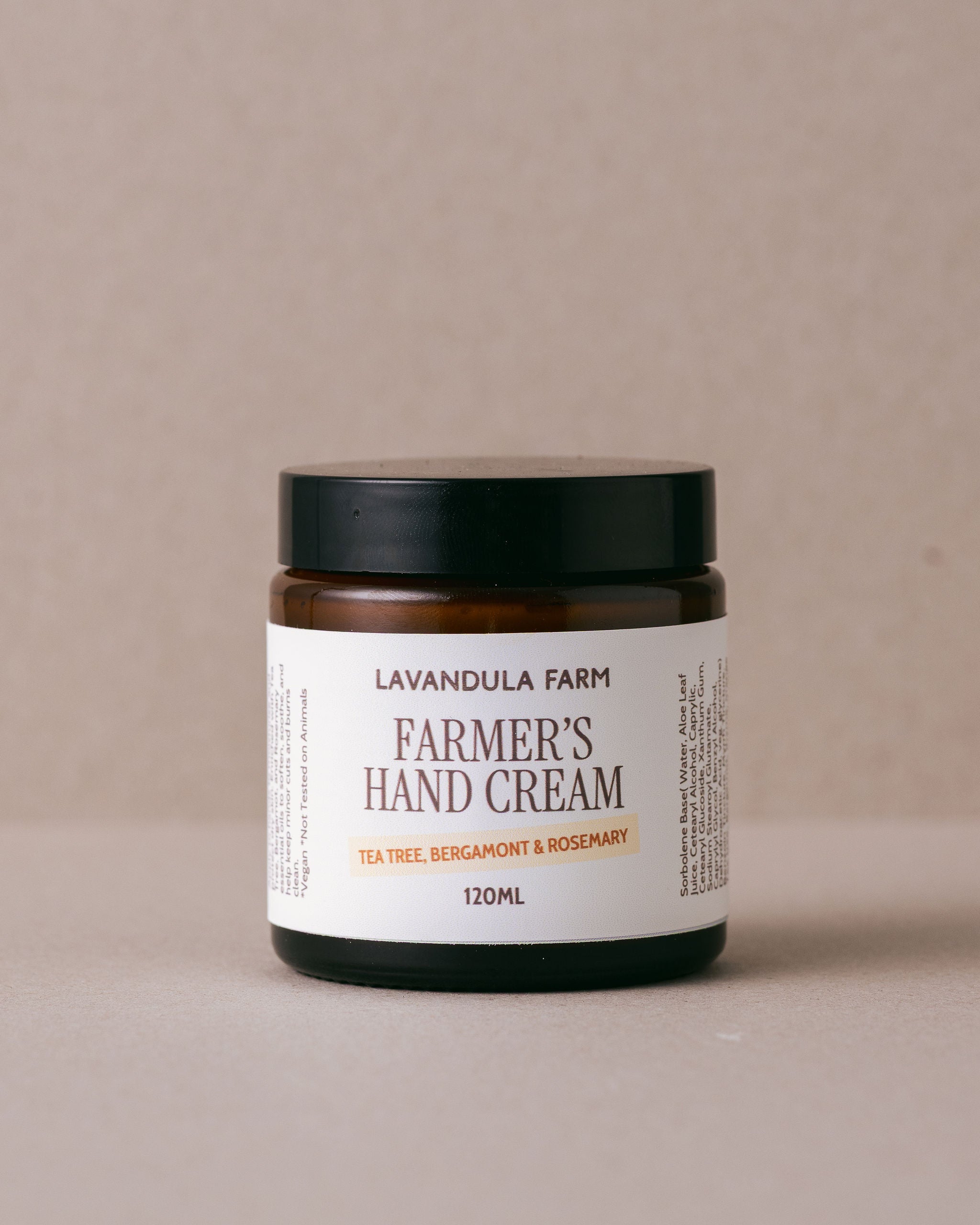 Jar of Farmer's Hand Cream from Lavandula Farm on a beige background
