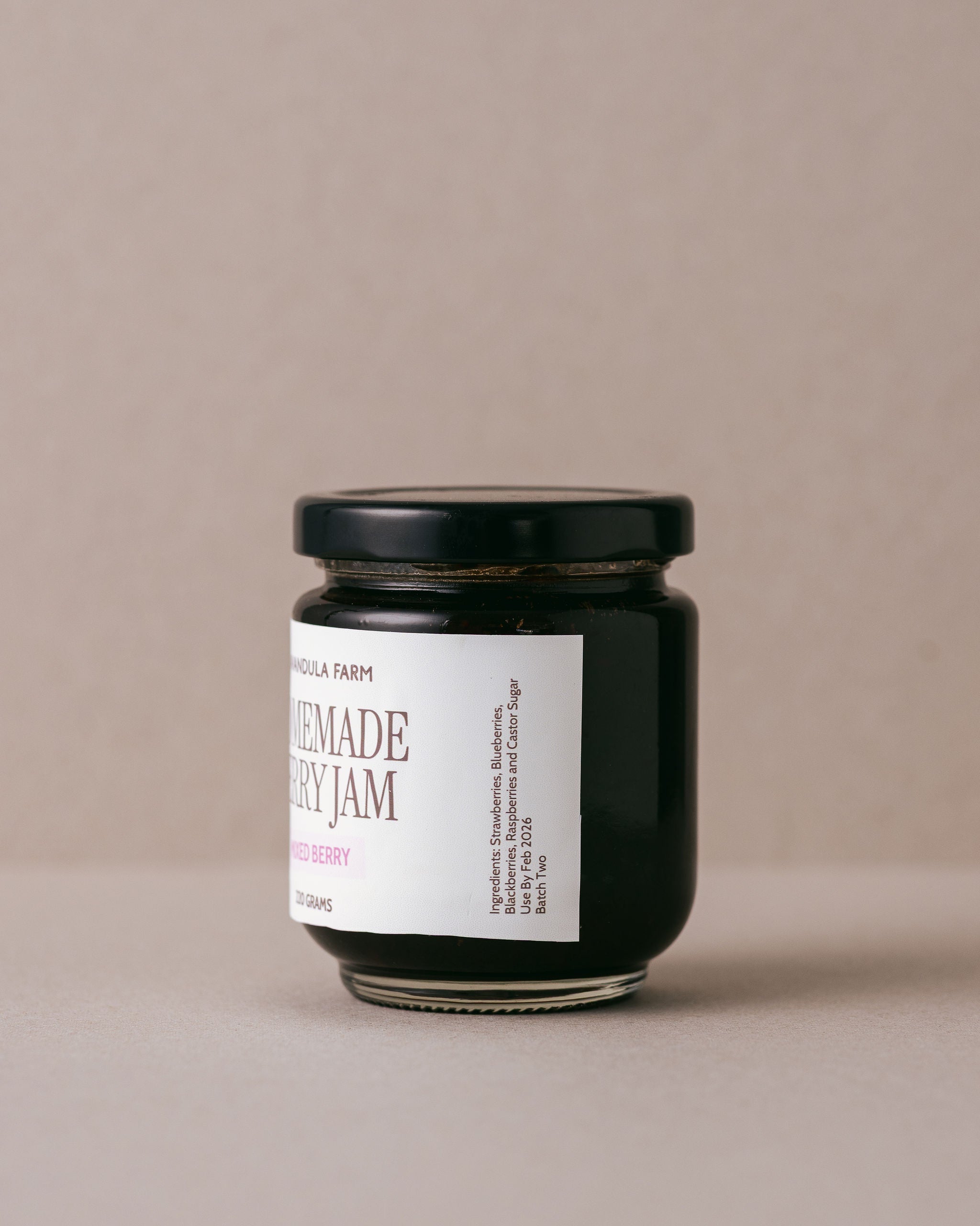 jar of Lavandula homemade berry jam on a beige background