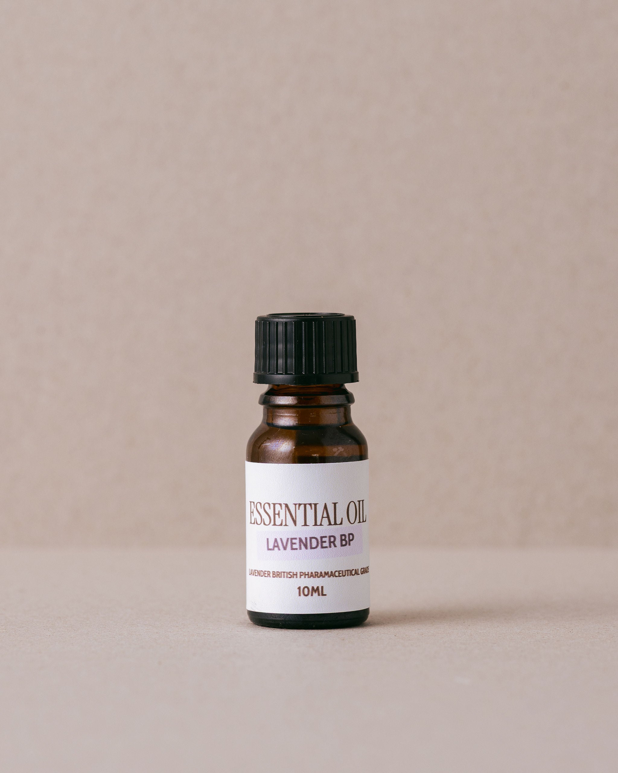 Bottle of lavender BP essential oil on a beige background
