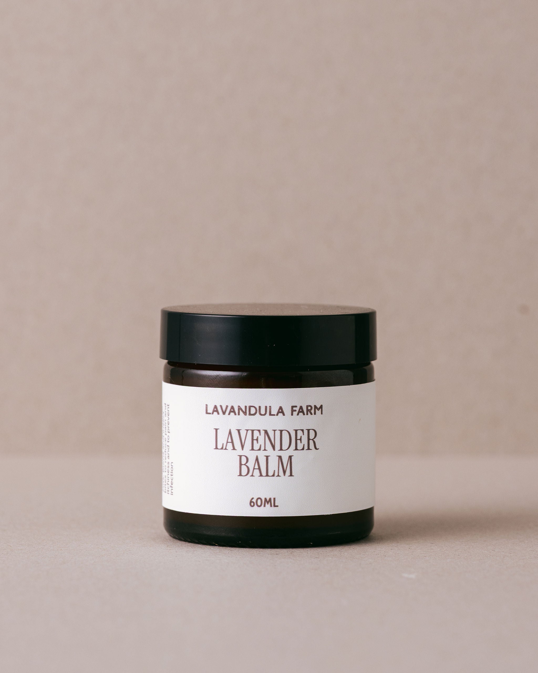 Jar of Lavender Balm from Lavandula Farm on a beige background