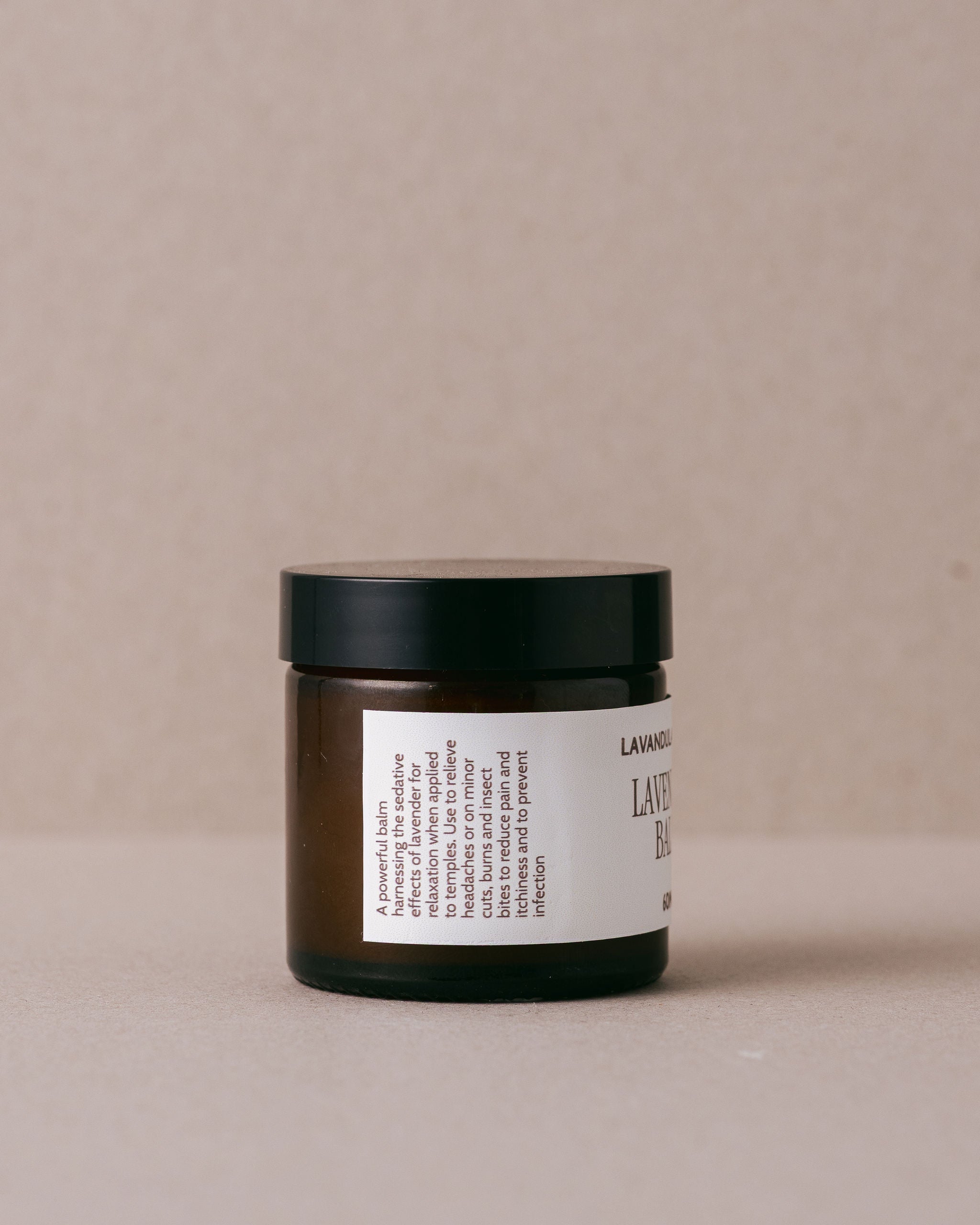 Jar of Lavender Balm from Lavandula Farm on a beige background