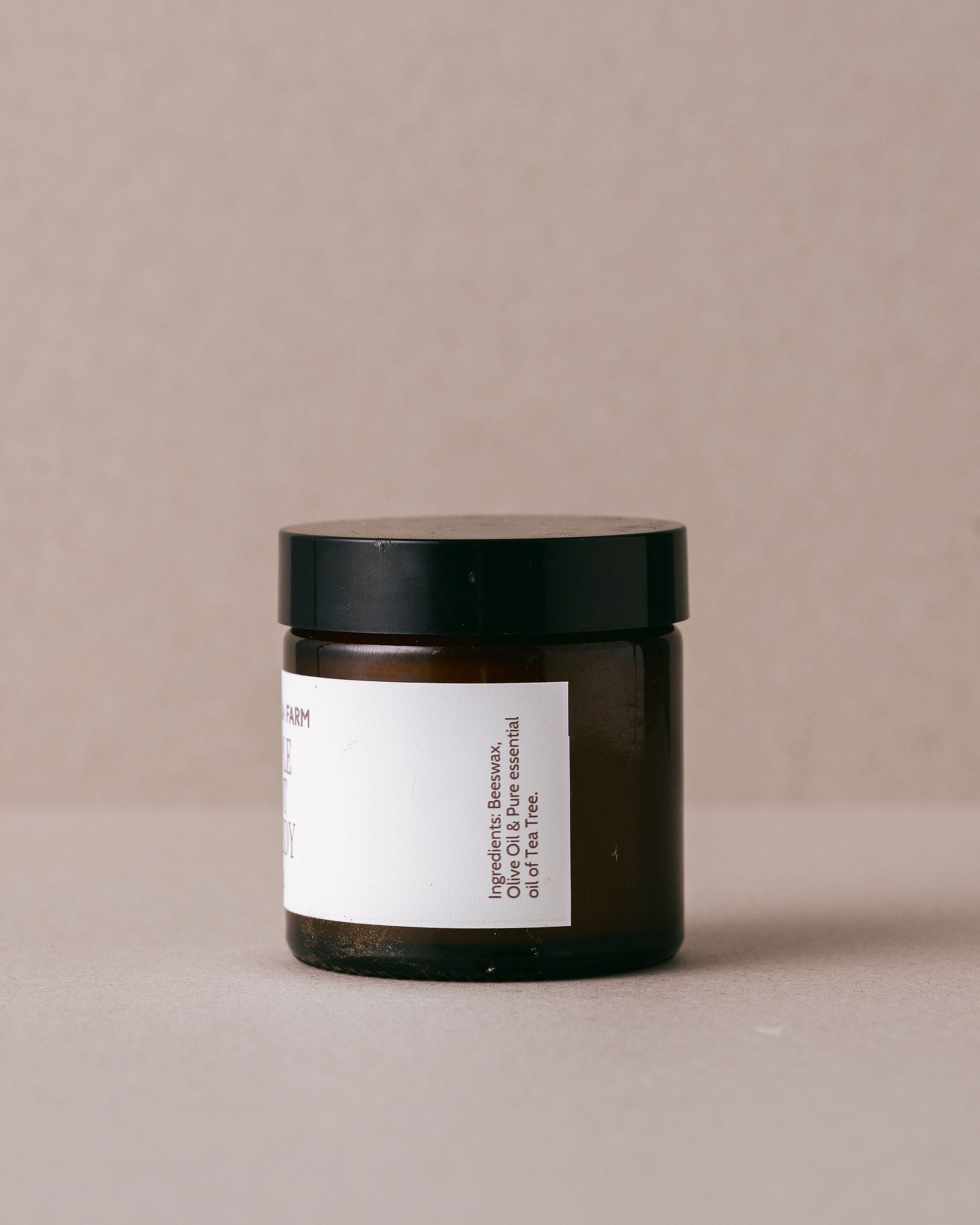 Jar of 'Pimple Spot Remedy' from Lavandula Farm on a beige background