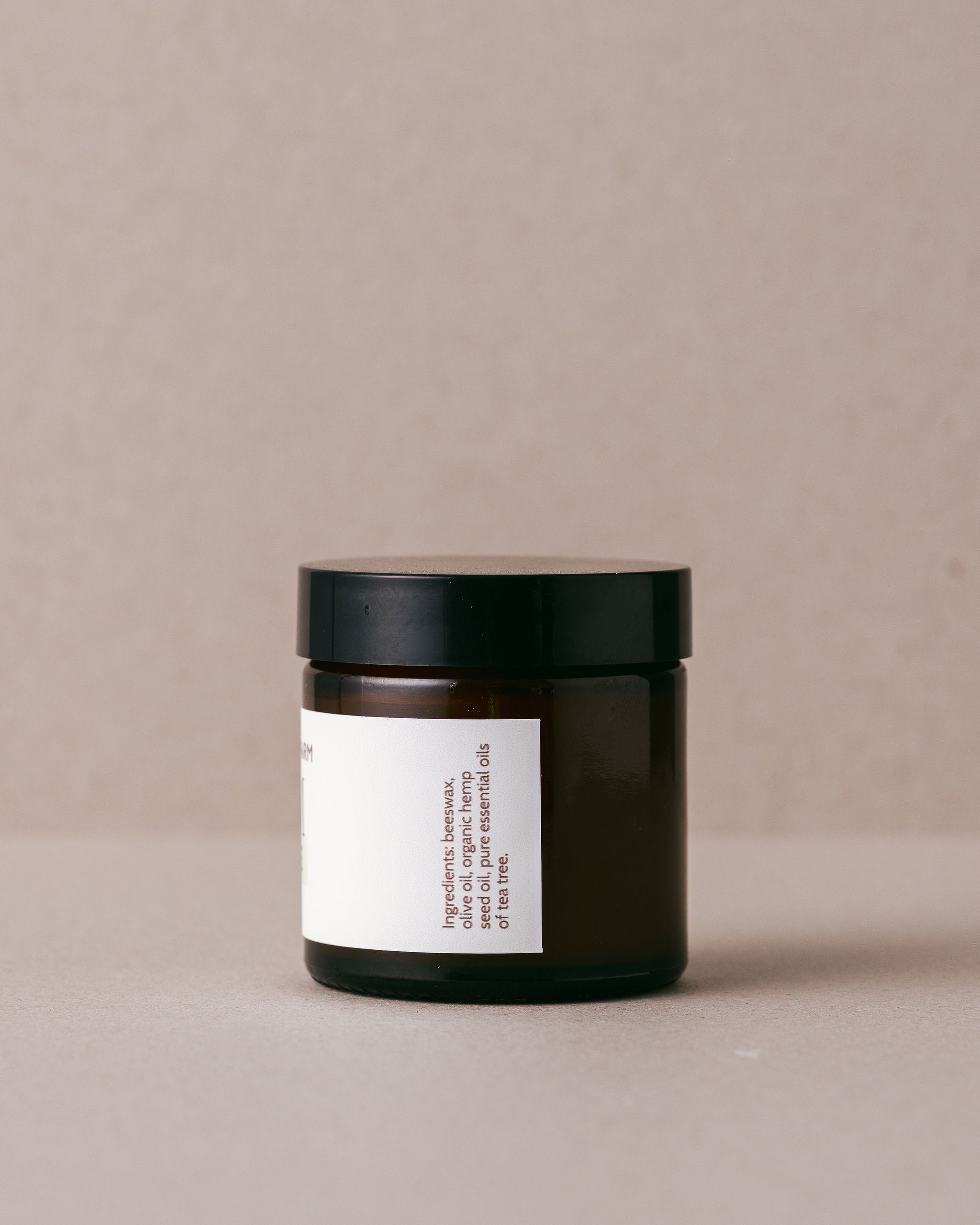 tea tree balm in a small glass jar made with natural ingredients at Lavandula Farm