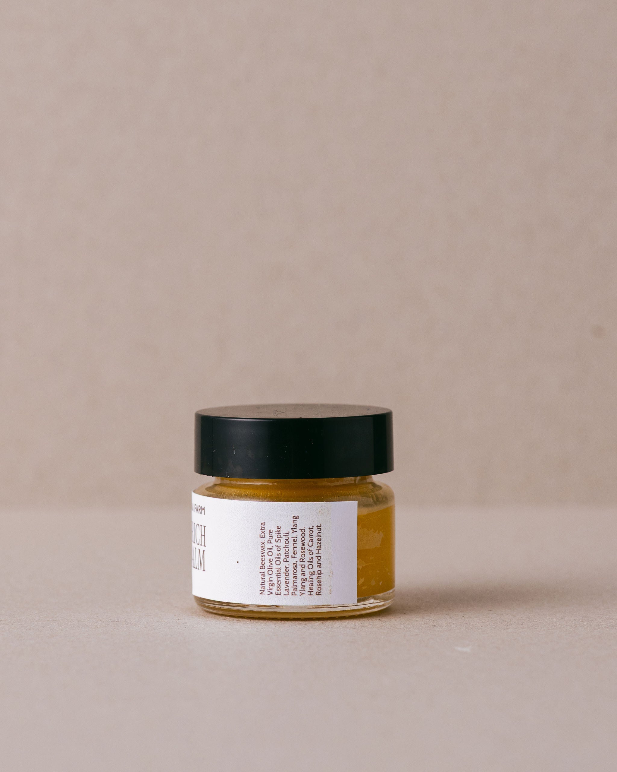 Jar of 'Very Rich Eye Balm' from Lavandula Farm on a beige background