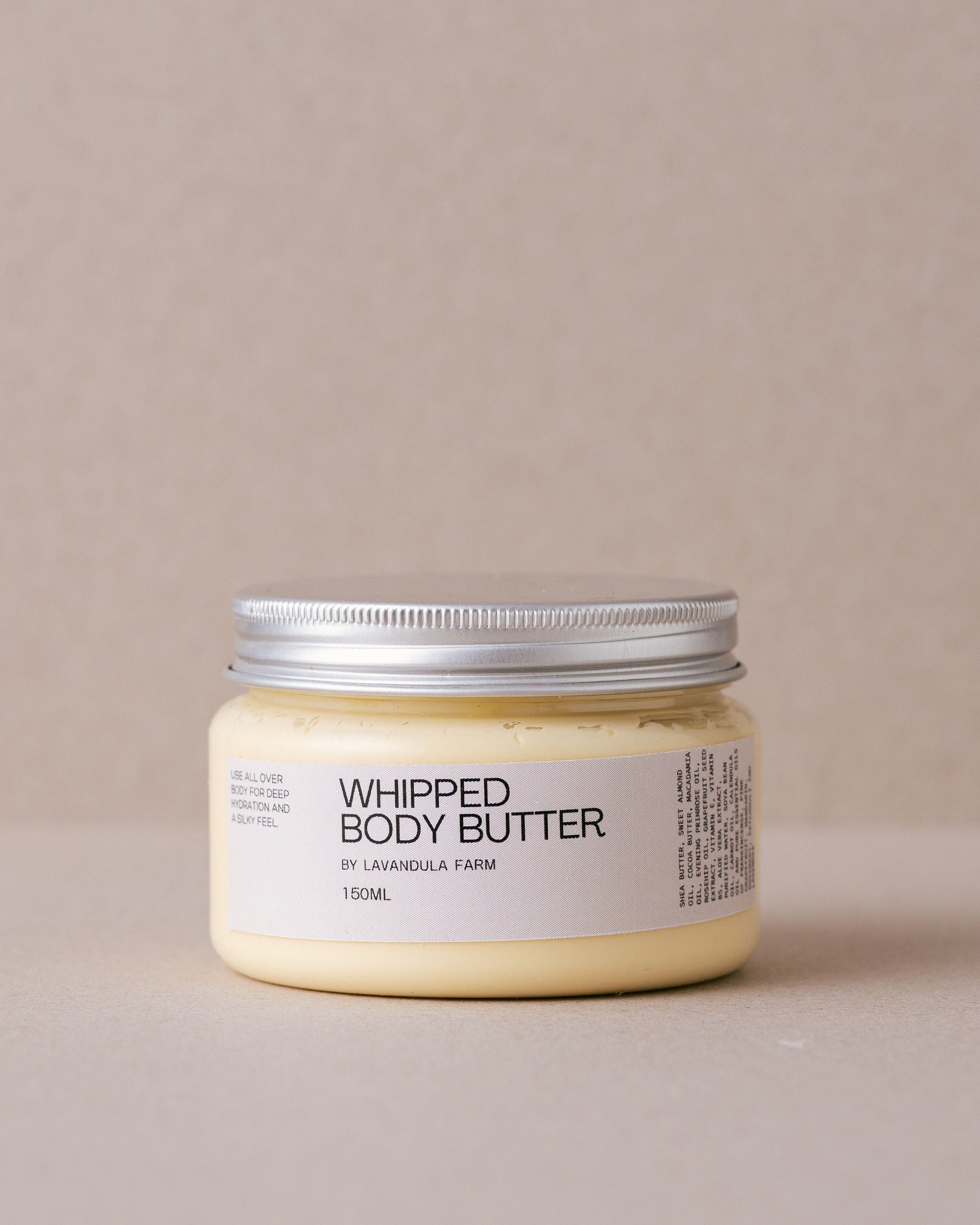 tub of whipped body butter made by Lavandula Farm on a beige background