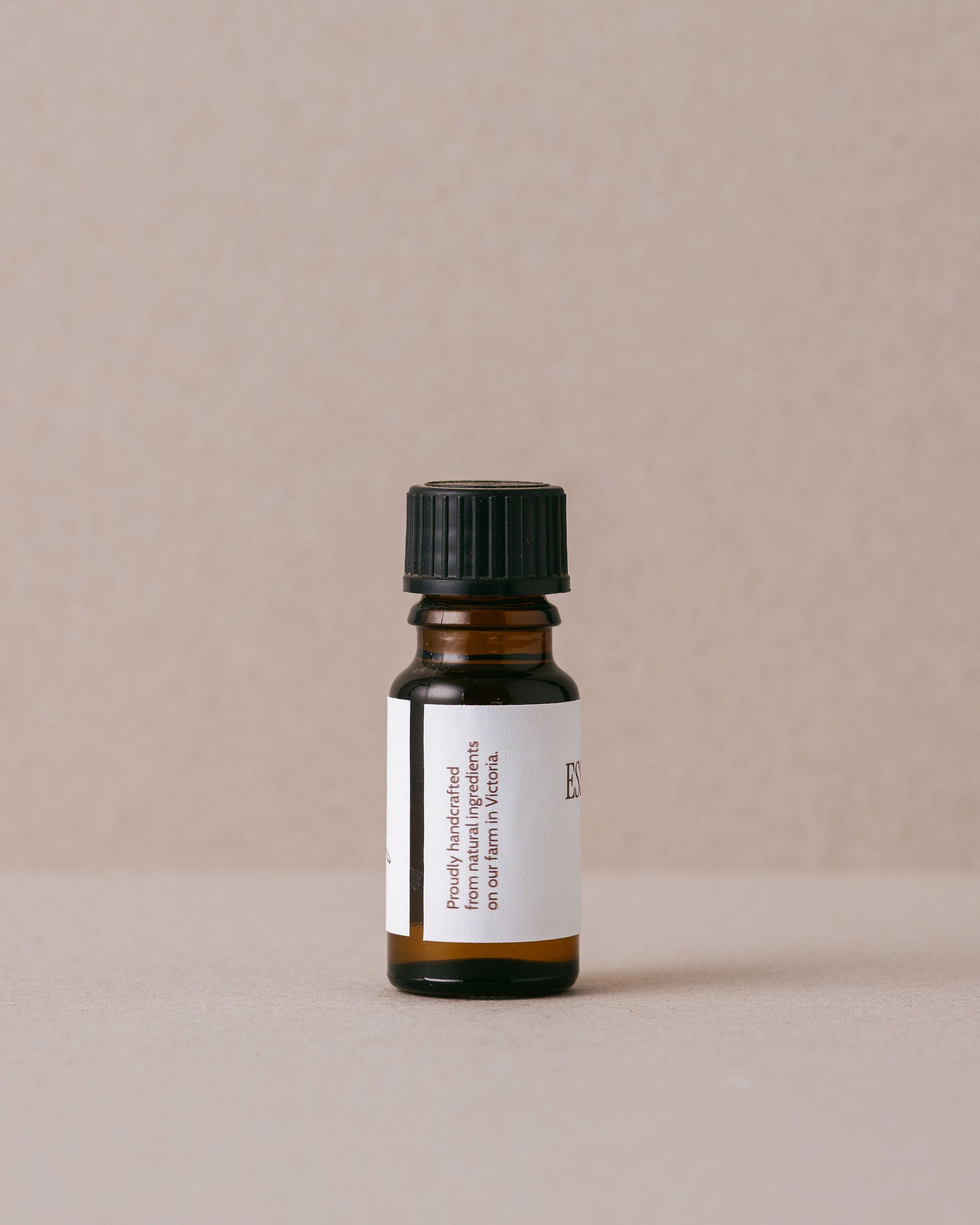 Basil essential oil in small glass bottle