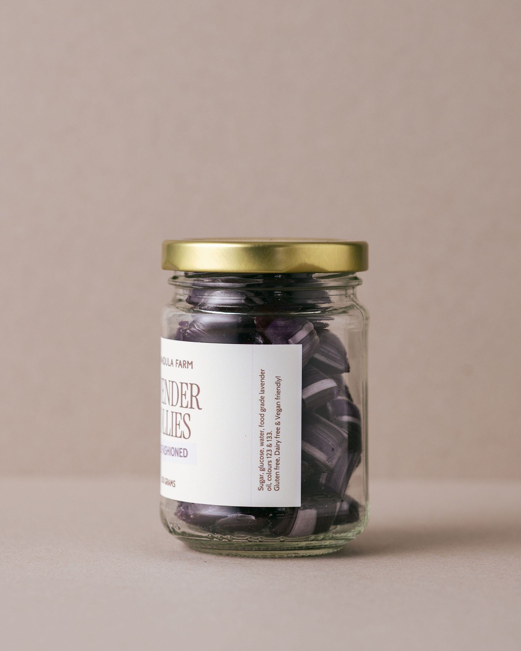 Old fashioned lavender lollies in a glass jar