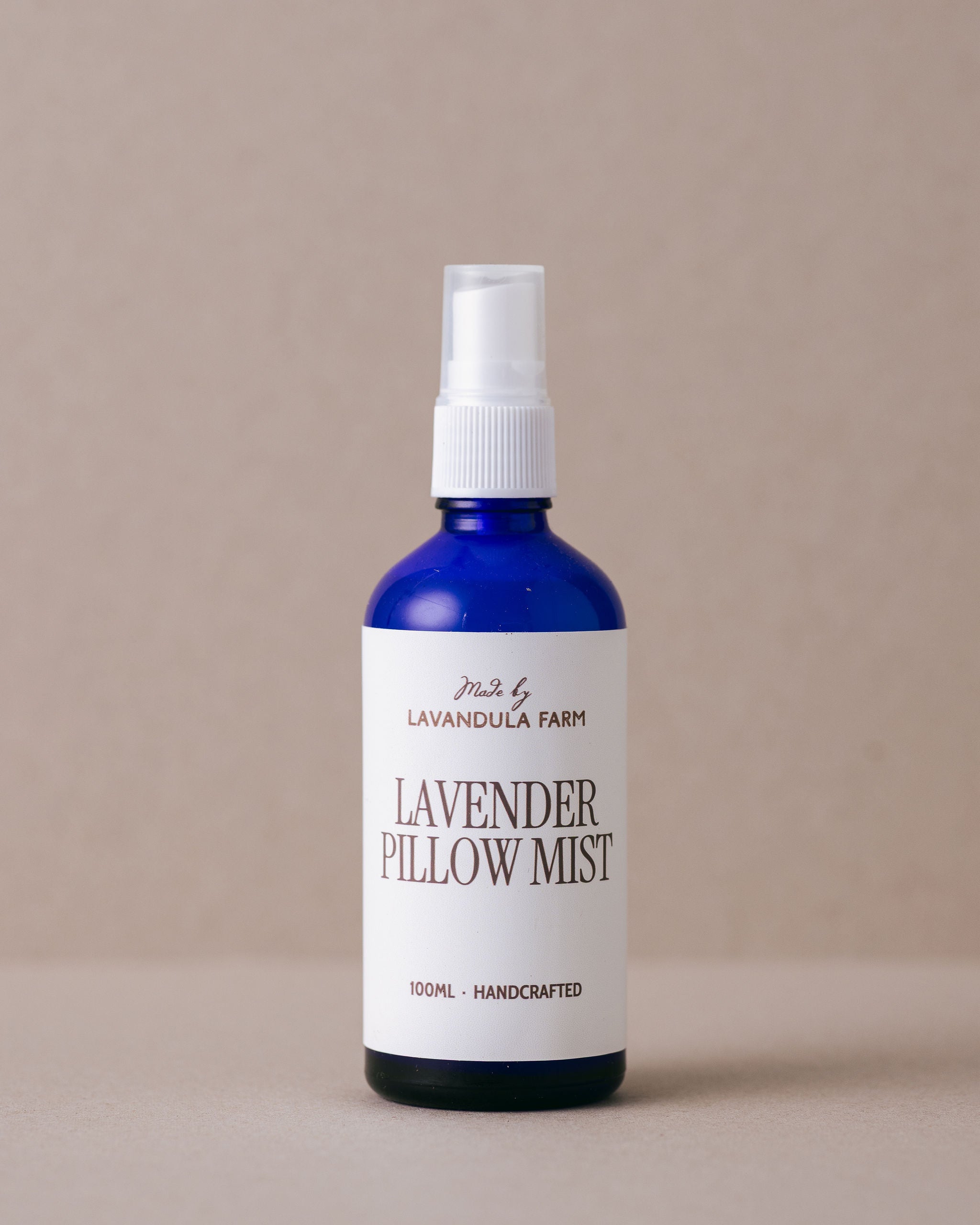 Iconic Lavandula lavender pillow mist in a blue glass bottle with  nozzle spray handmade at Lavandula Farm