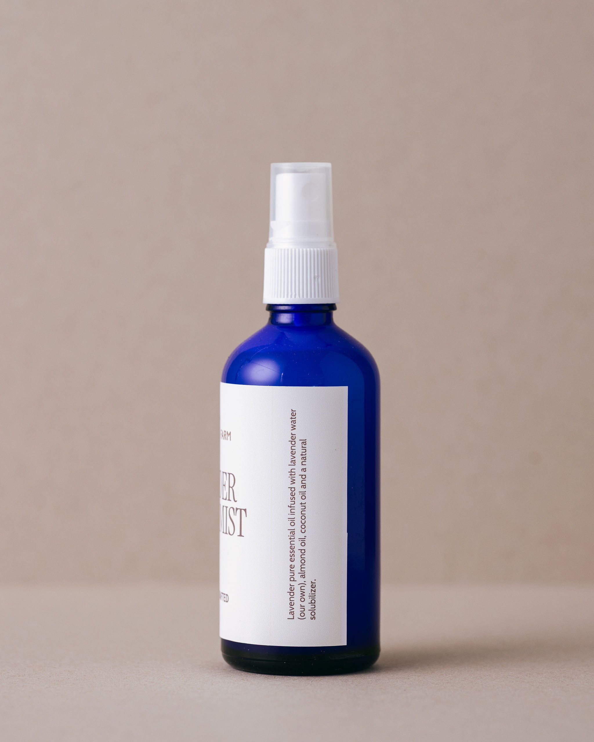 Iconic Lavandula lavender pillow mist in a blue glass bottle with  nozzle spray handmade at Lavandula Farm