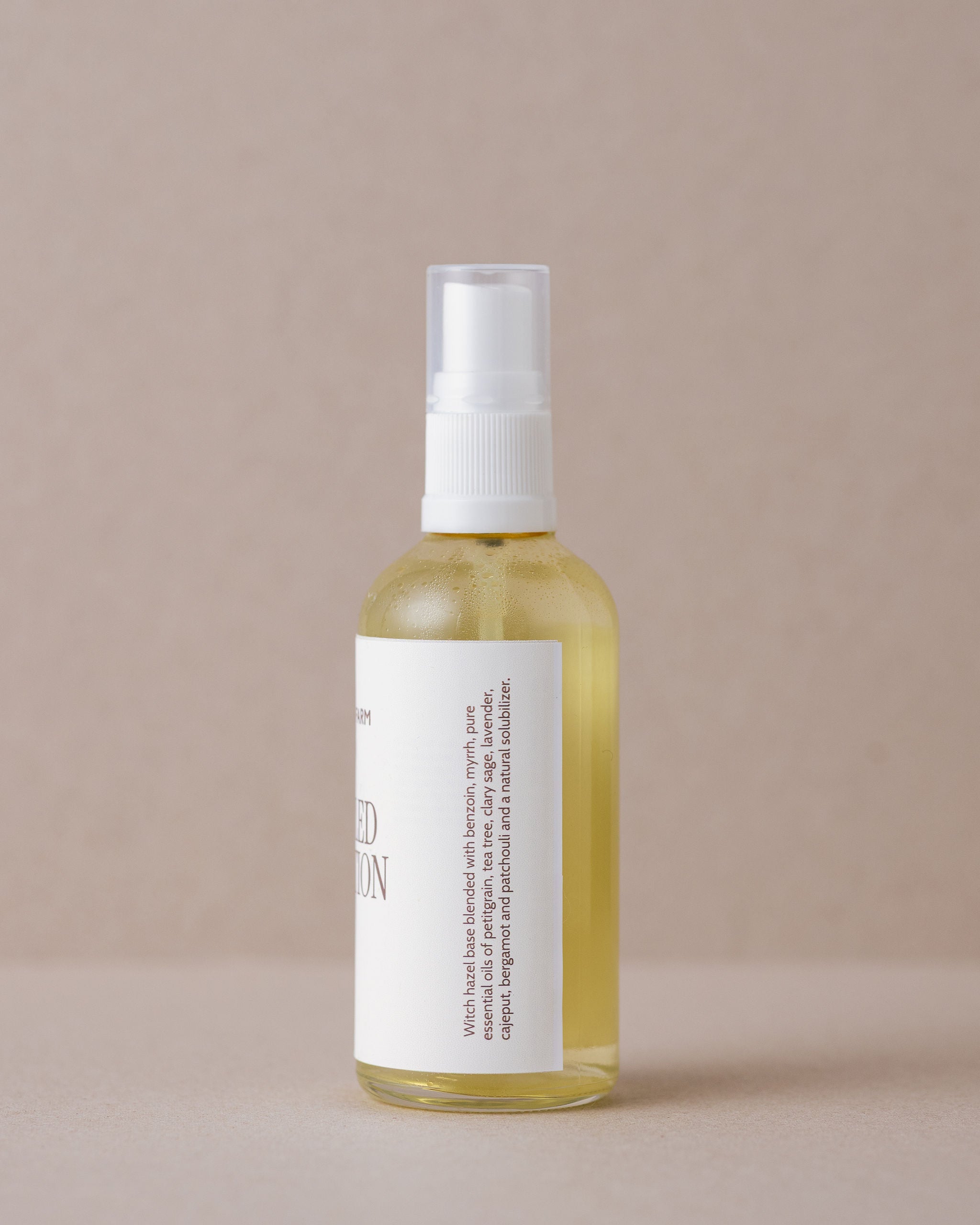 A specialised face lotion for troubled skin in a glass bottle handmade at Lavandula Farm