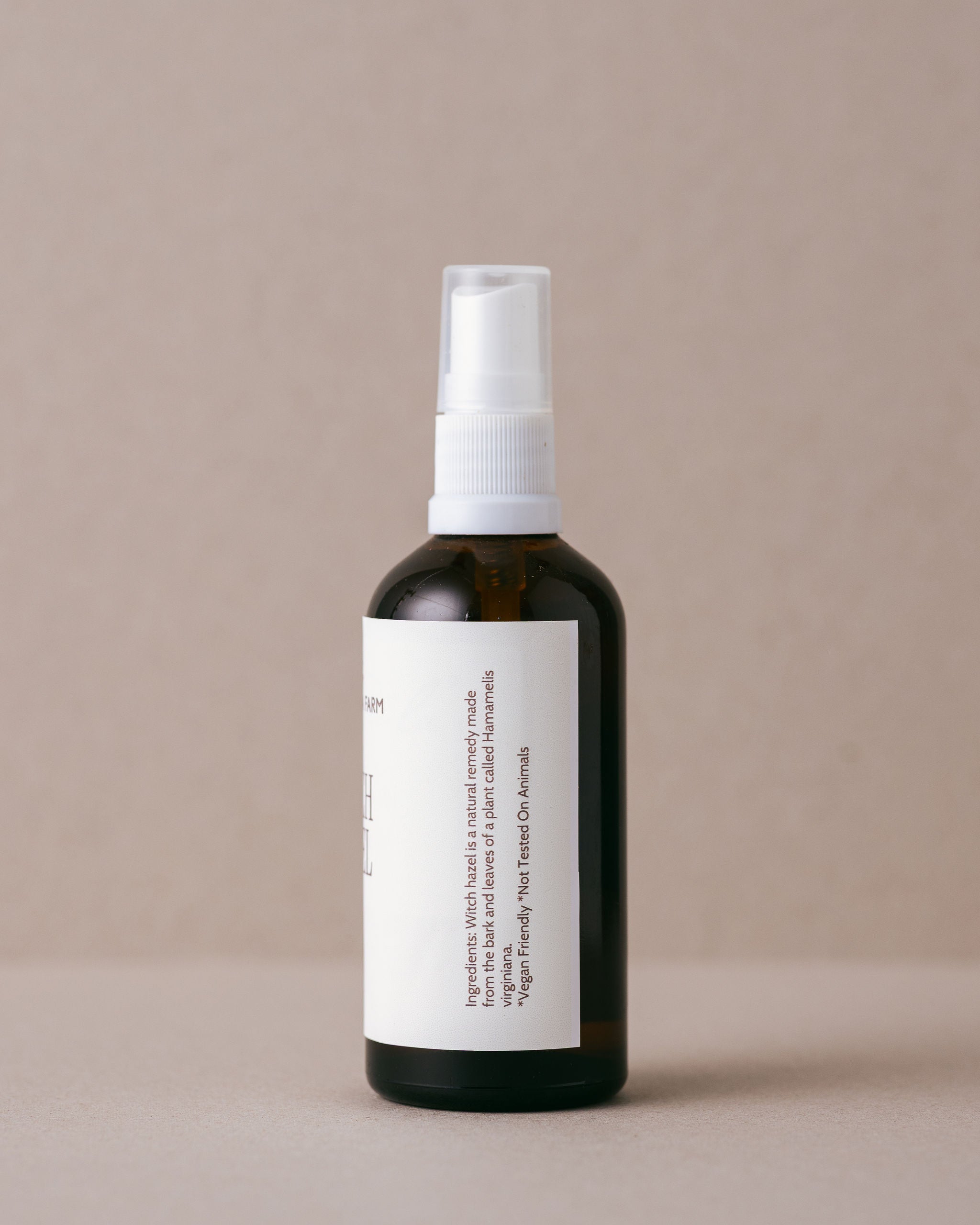 Natural pure witch hazel in a glass jar with  a spray top