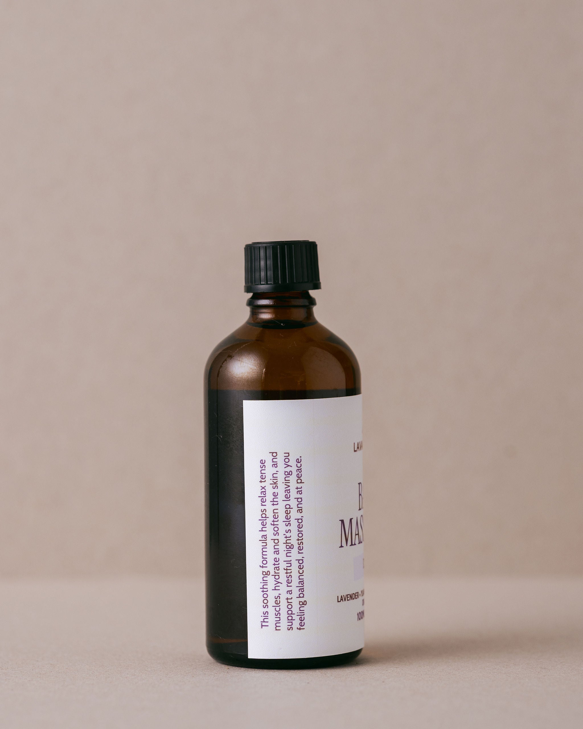 Brown bottle with a black cap on a beige background