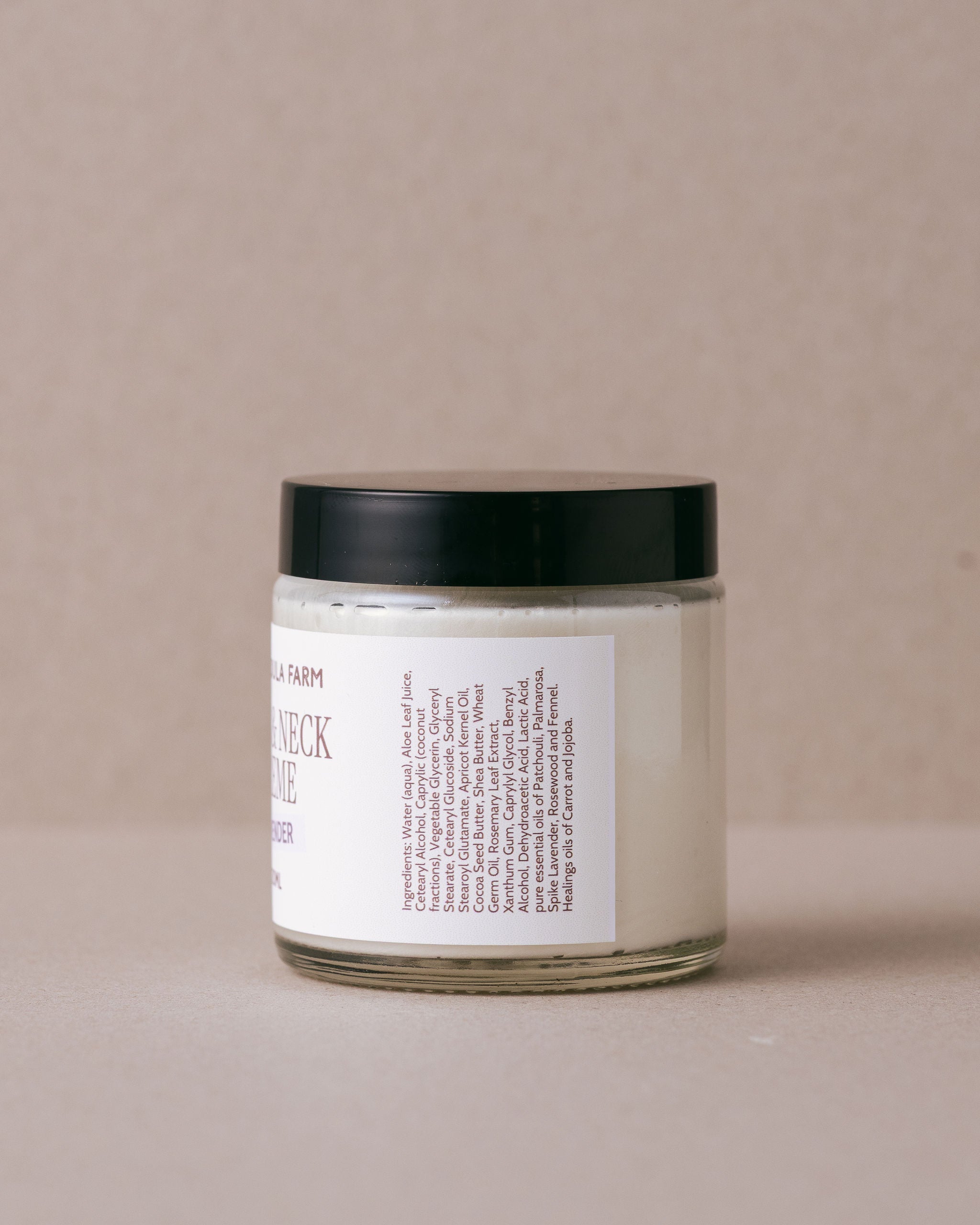 Face and neck creme in a glass jar with a white label handmade at Lavandula Farm