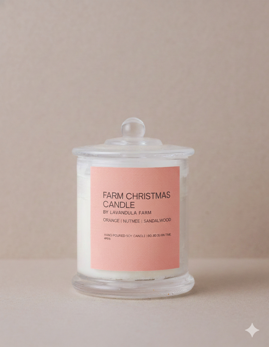 christmas soy candle in a glass container on a beige background