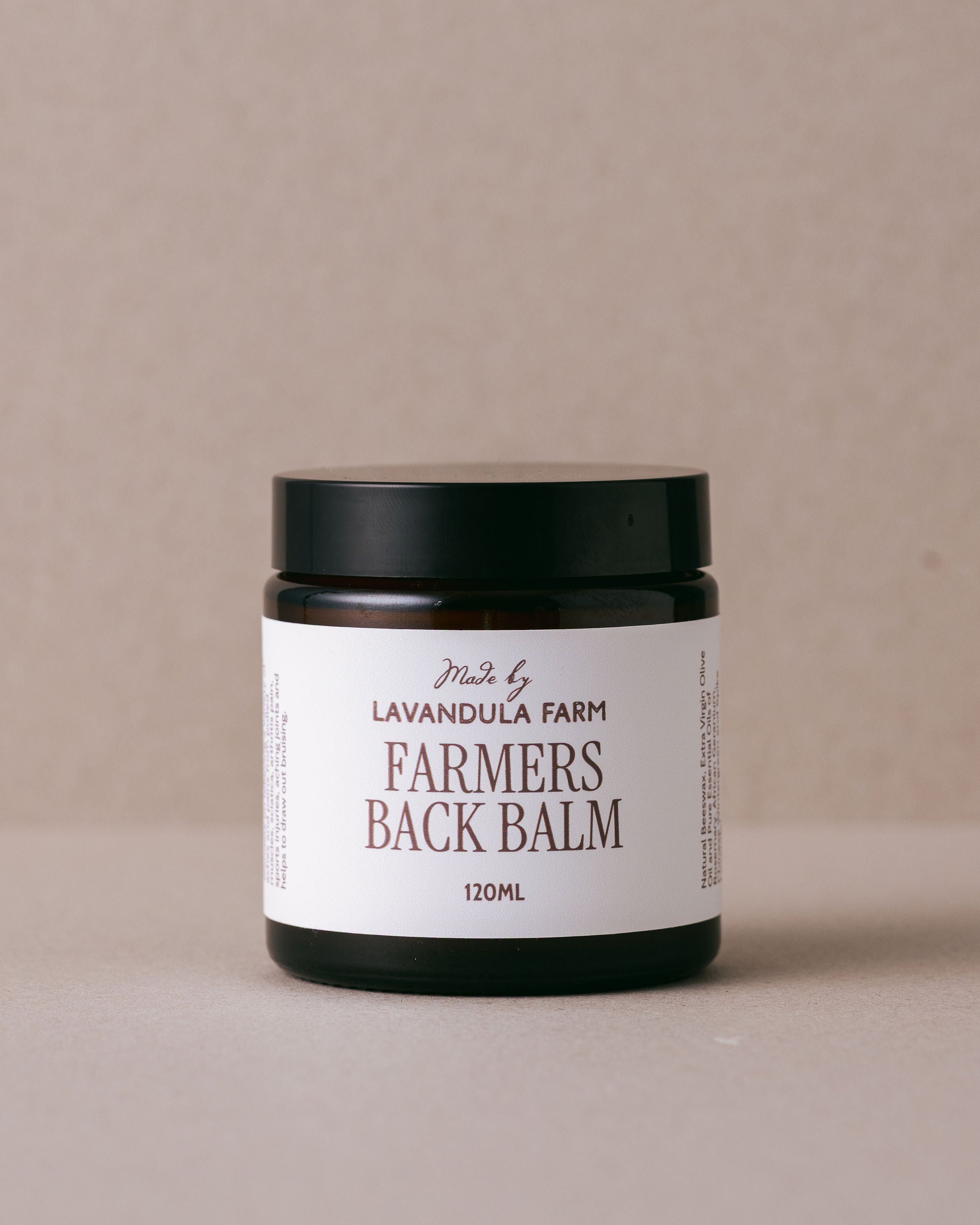 glass jar of farmer's back balm made with natural ngredients at Lavandula Farm