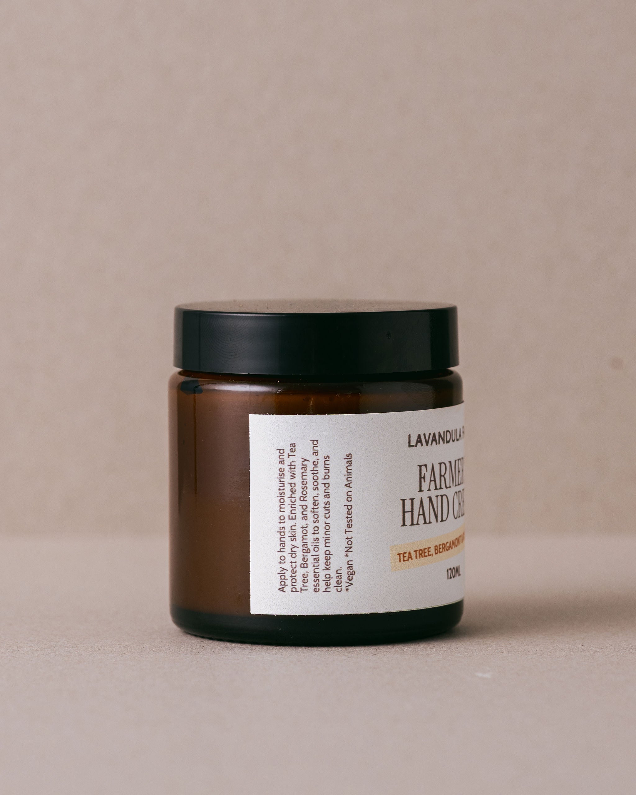Jar of Farmer's Hand Cream from Lavandula Farm on a beige background