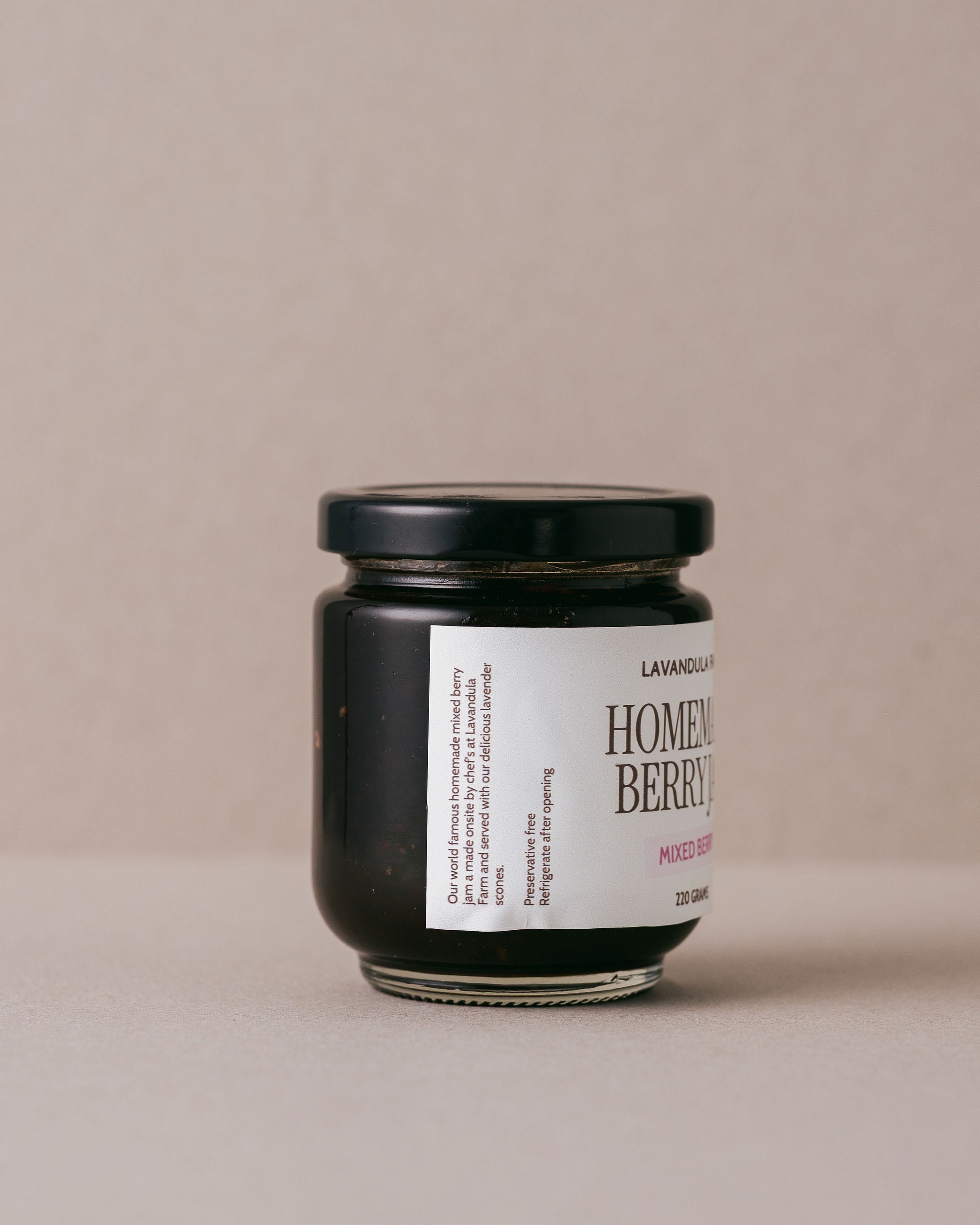 jar of Lavandula homemade berry jam on a beige background