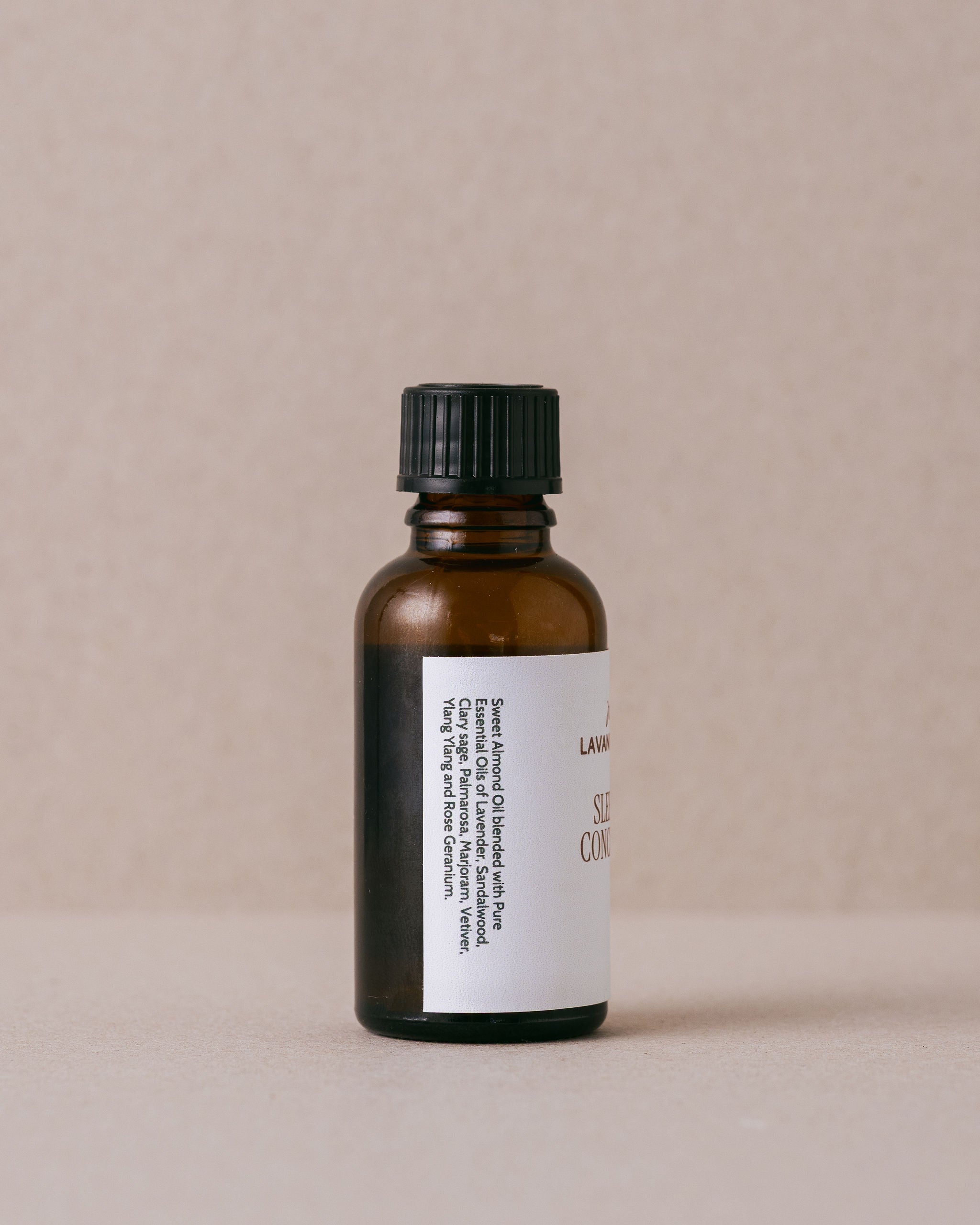Bottle of 'Sleep Easy Concentrate' by Lavandula Farm on a beige background