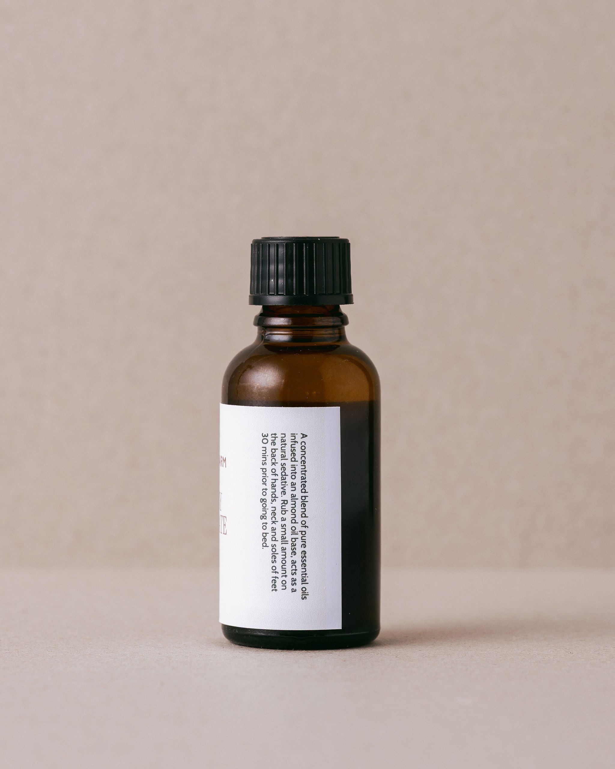 Bottle of 'Sleep Easy Concentrate' by Lavandula Farm on a beige background