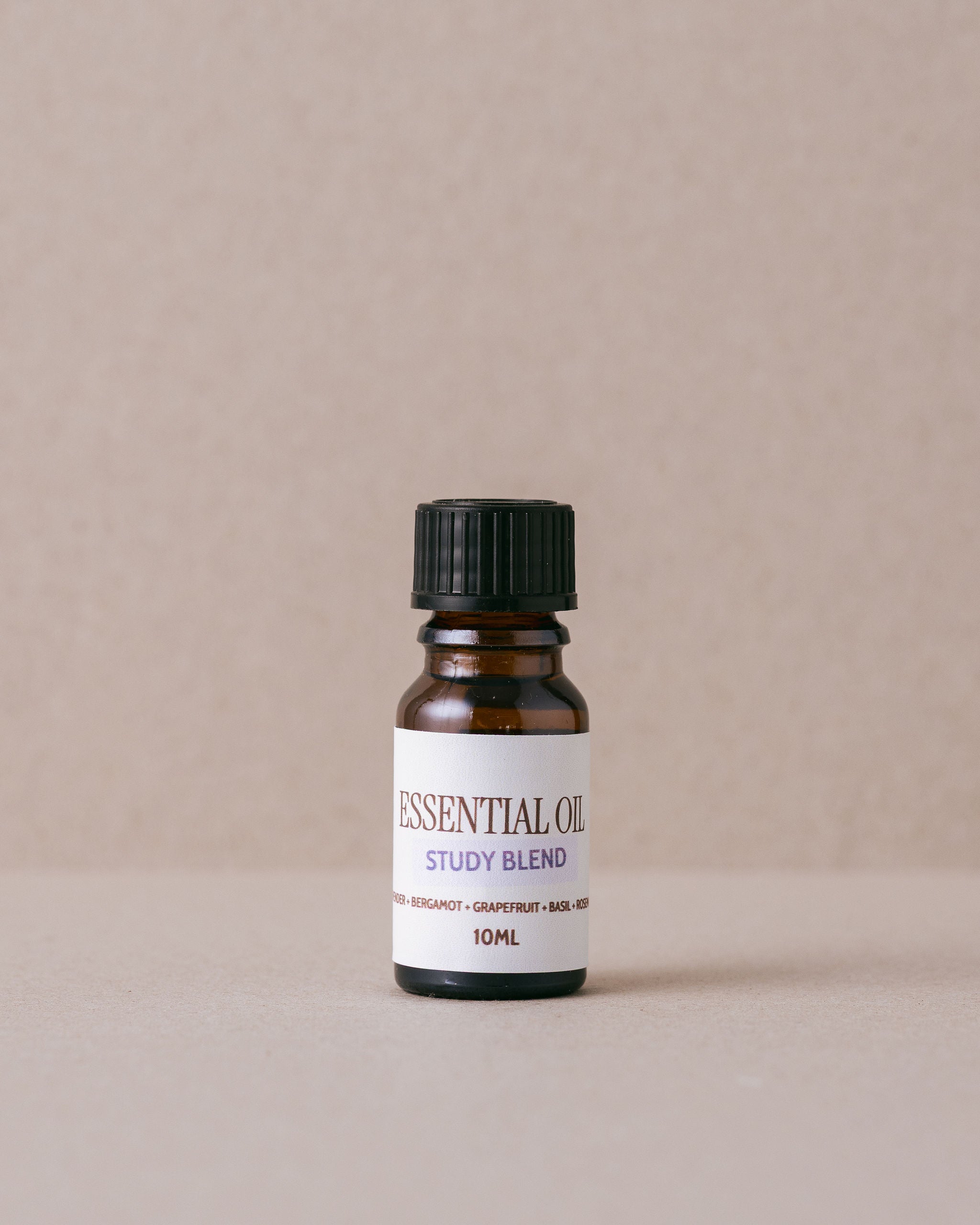 small bottle of pure essential oils on a beige background