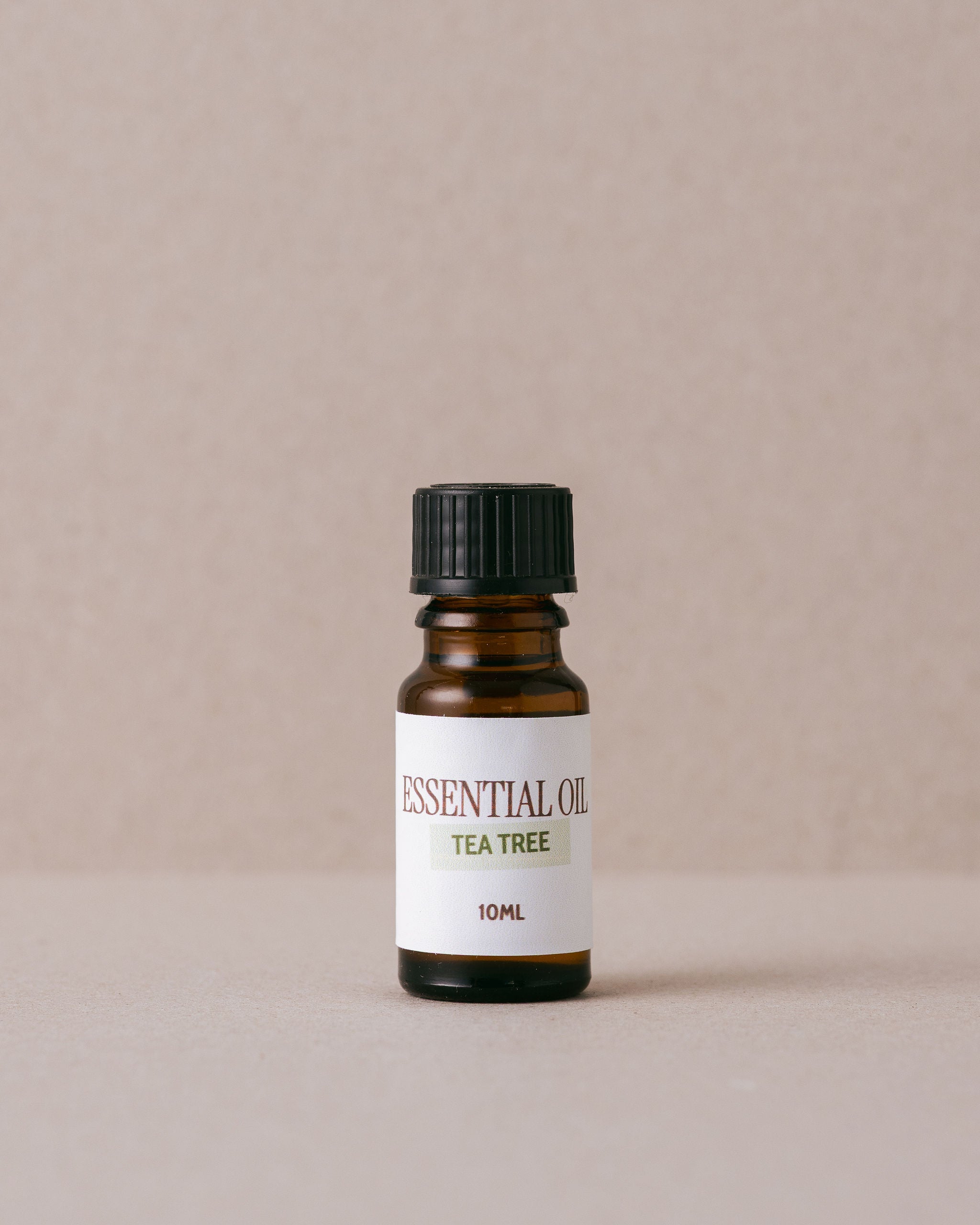 tea tree essential oil on a beige background